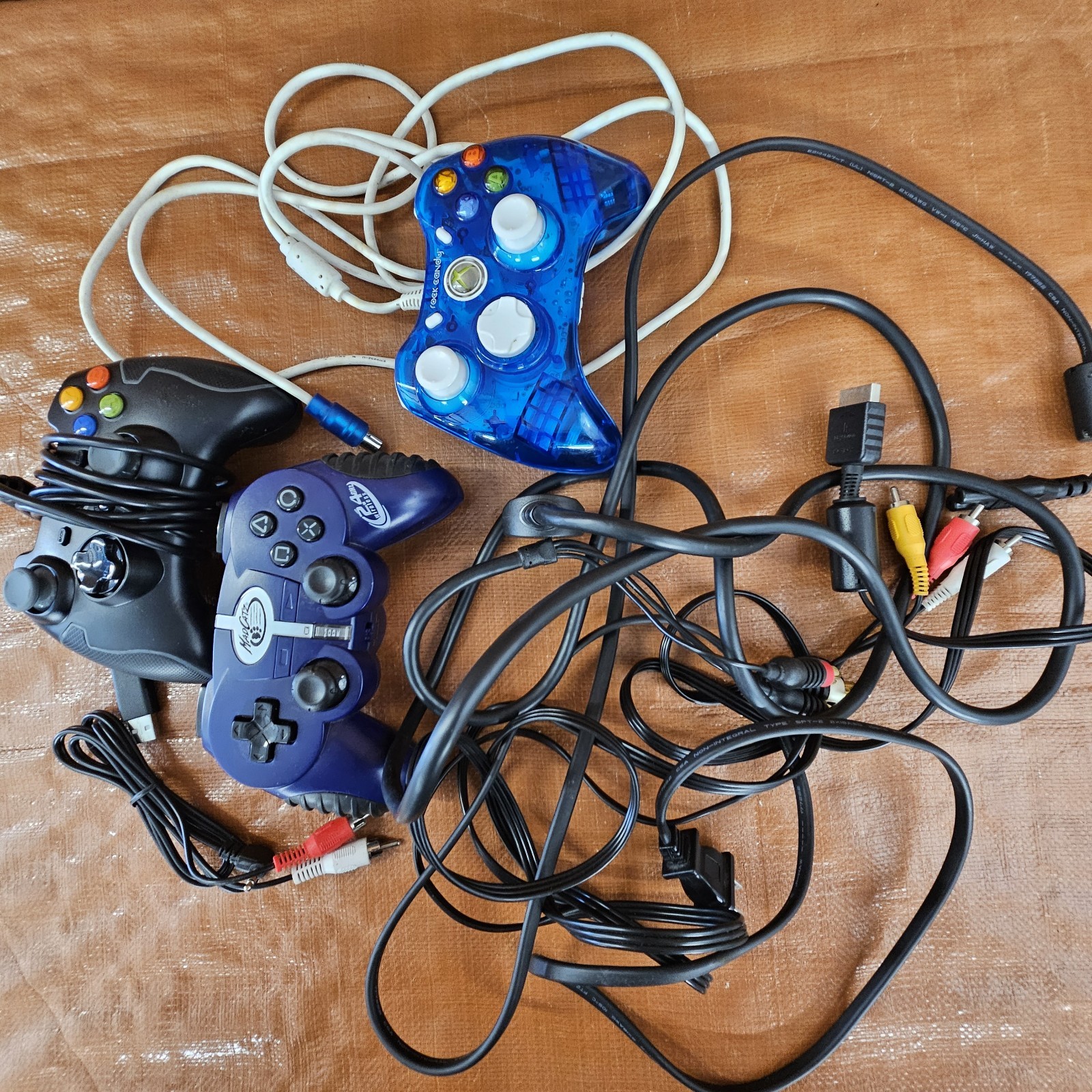 LOT: 14 X-box Games/4 Play Station Games. Plus MISC. cables & Controllers READ